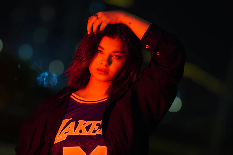 Stylish BBW woman in a black jacket posing