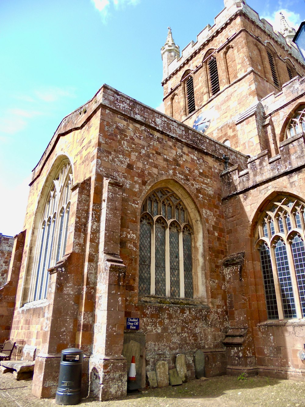 a large brick building with a tall tower