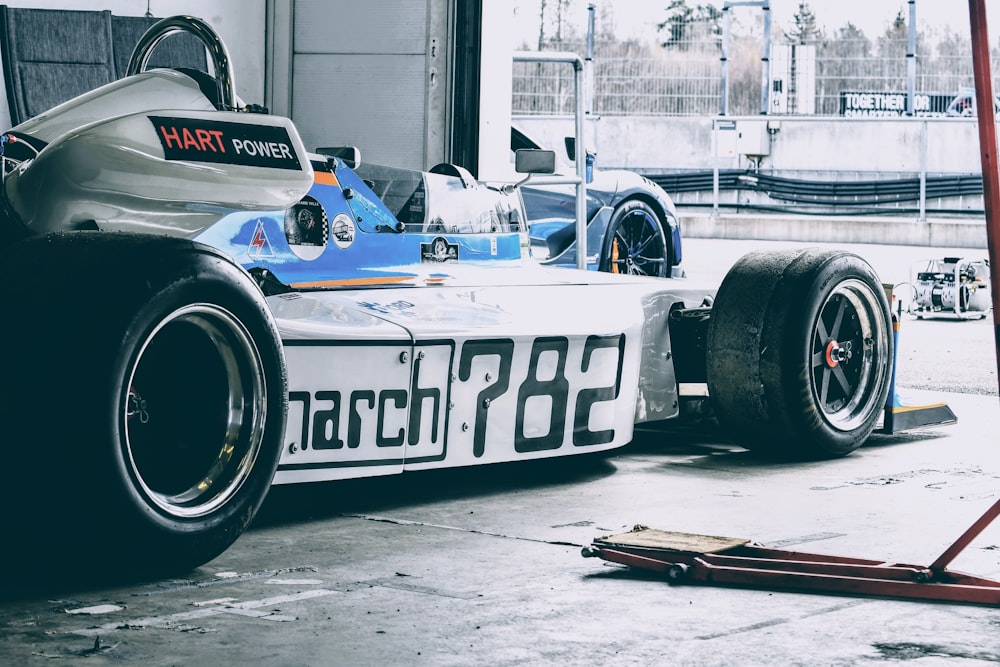 a race car is parked in a garage