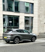 Gray crossover vehicle positioned on a city street, ready for urban adventures.