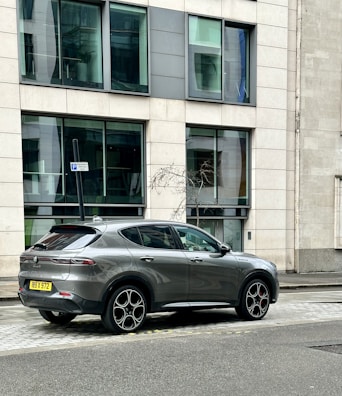 Gray crossover vehicle positioned on a city street, ready for urban adventures.