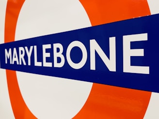 a close up of a street sign with a sky background