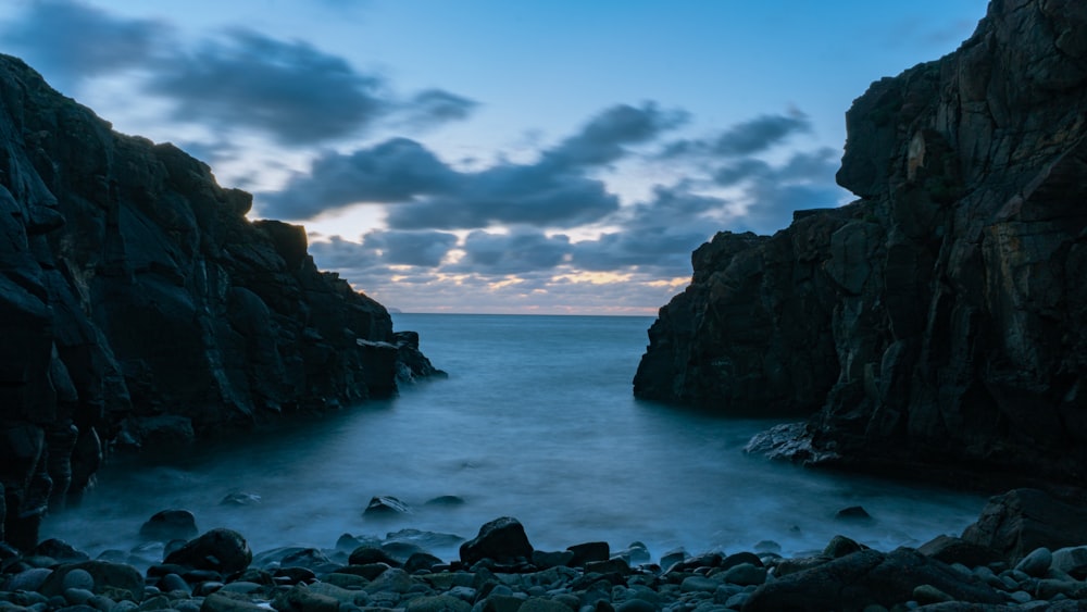 a large body of water surrounded by rocks