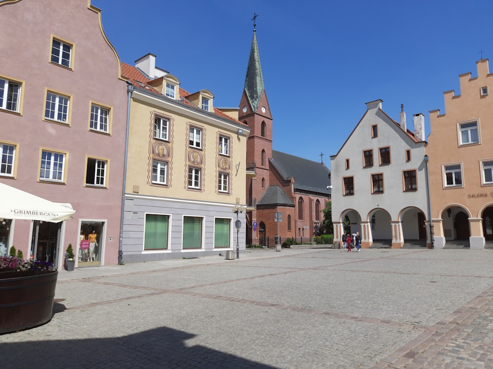 a cobblestone street lined with tall buildings