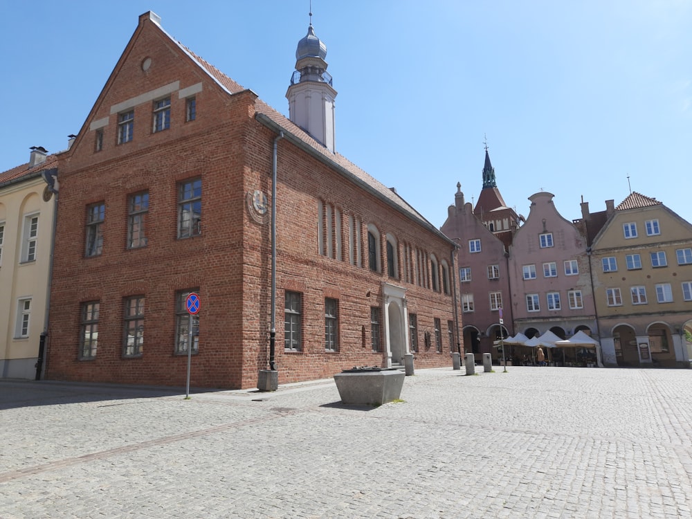 a brick building with a clock tower on top of it