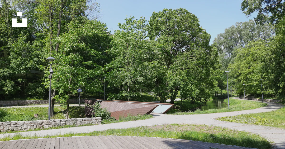 Unsplash Ramps A skateboard park with ramps and trees in the background photo – Free ...