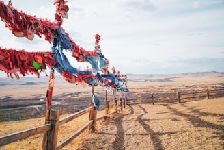 A panoramic view of the forum venue with banners highlighting peace and leadership themes under a clear Arizona sky.