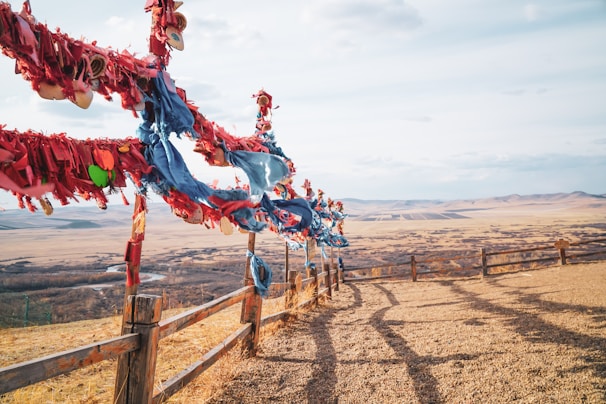 A panoramic view of the forum venue with banners highlighting peace and leadership themes under a clear Arizona sky.