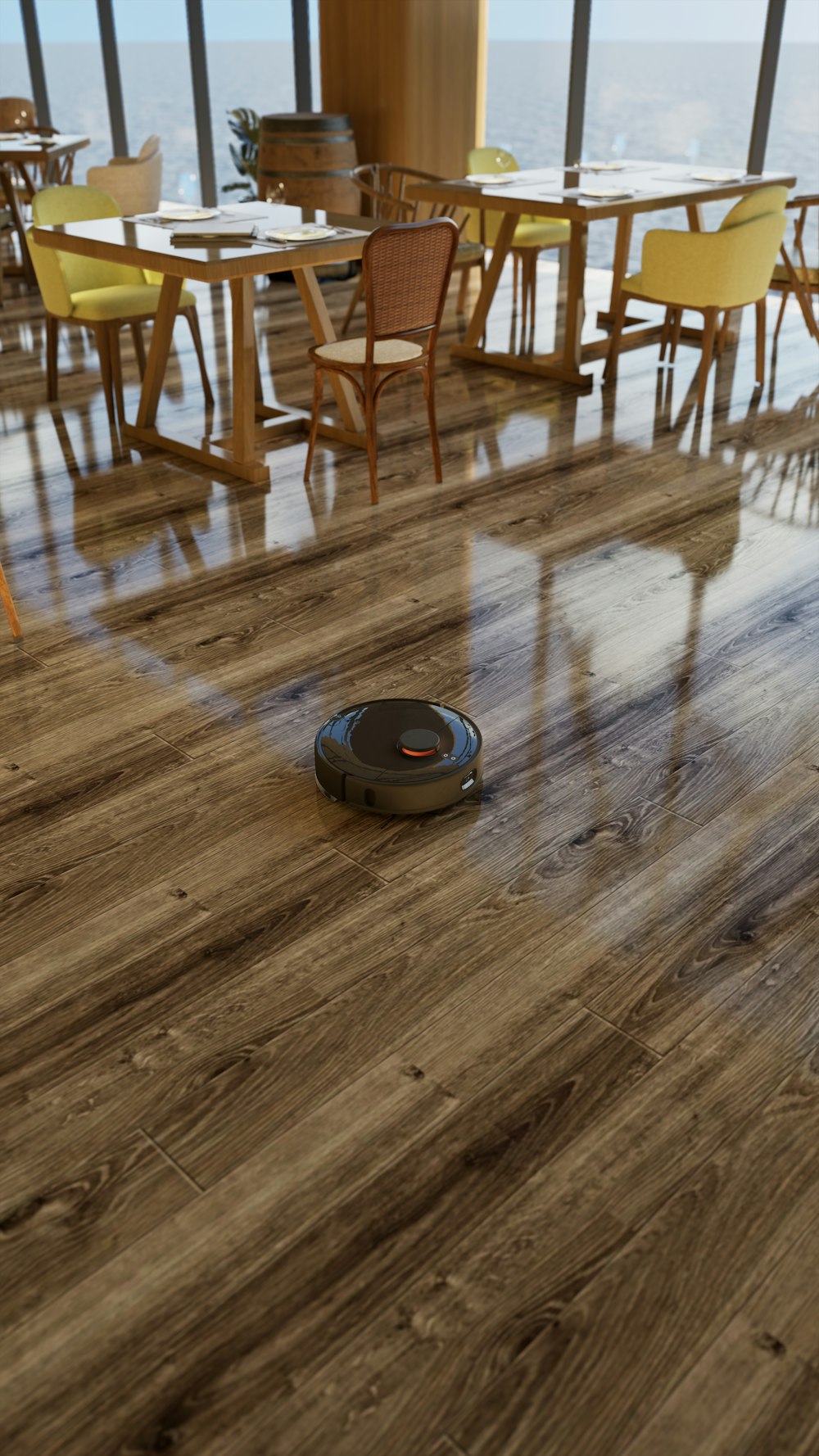 a room with a hard wood floor and a robot vacuum on the floor