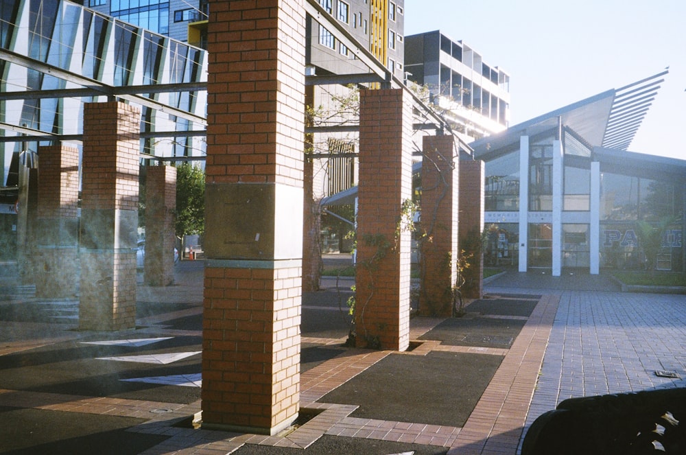 a row of brick pillars in front of a building