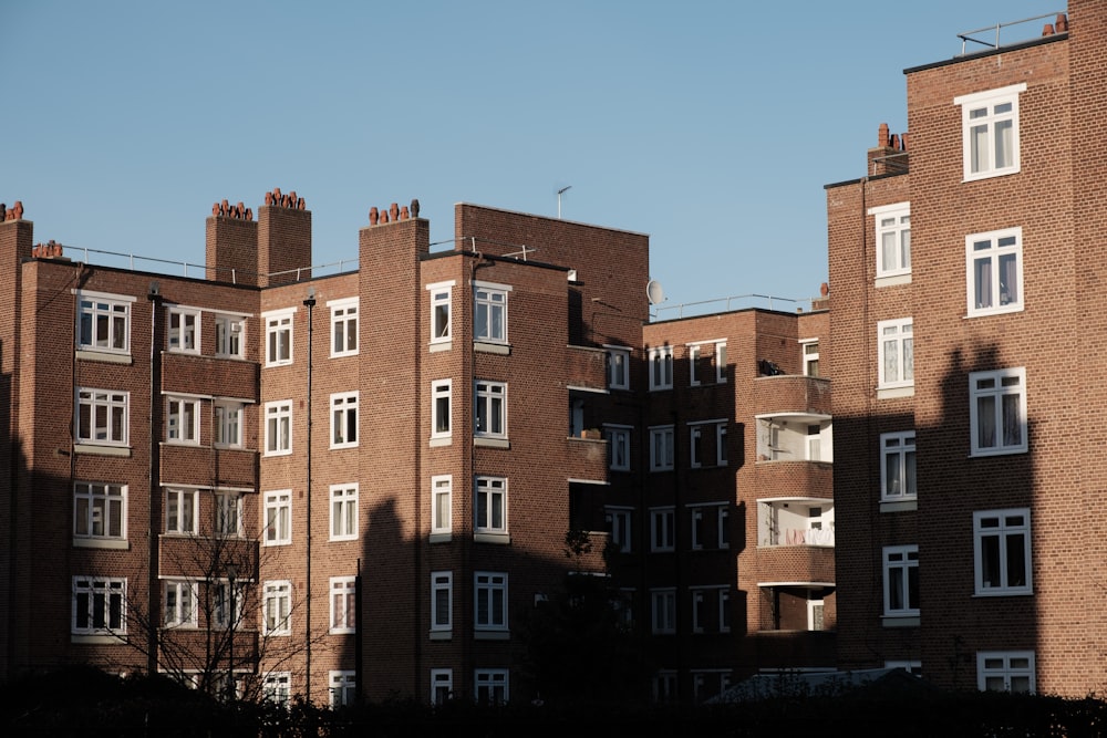 a tall brick building with lots of windows