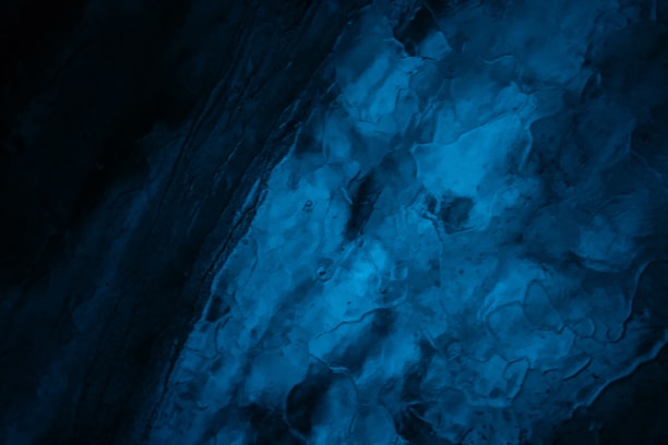 Abstract texture in deep navy blue suggesting trust and depth.