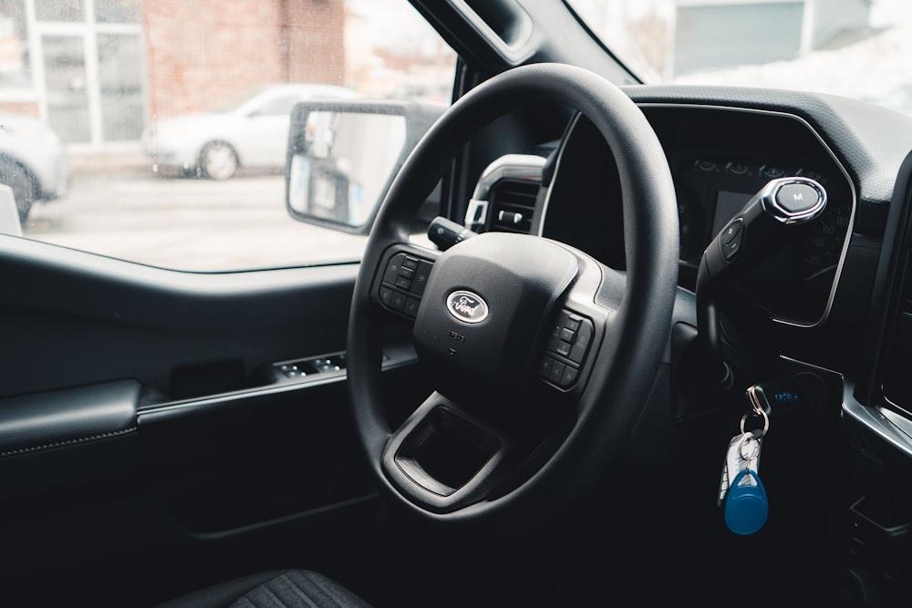 the interior of a vehicle with a steering wheel