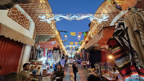 A colorful market street bustling with local vendors and handmade crafts in the golden hour.