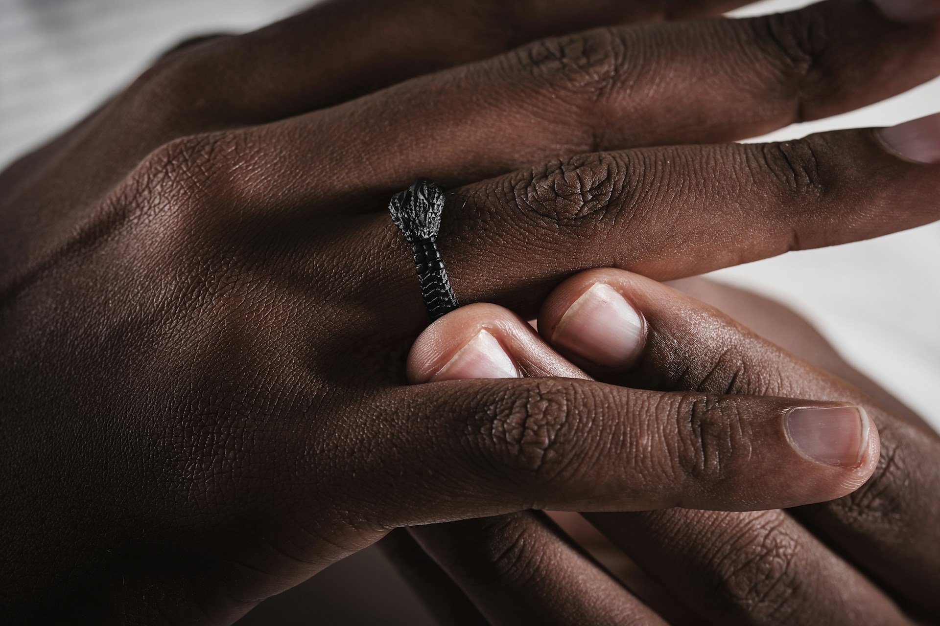 a close up of a person holding a ring