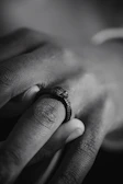 Close-up of a textured handmade ring with a matte finish and subtle details.