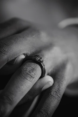 Close-up of a textured handmade ring with a matte finish and subtle details.