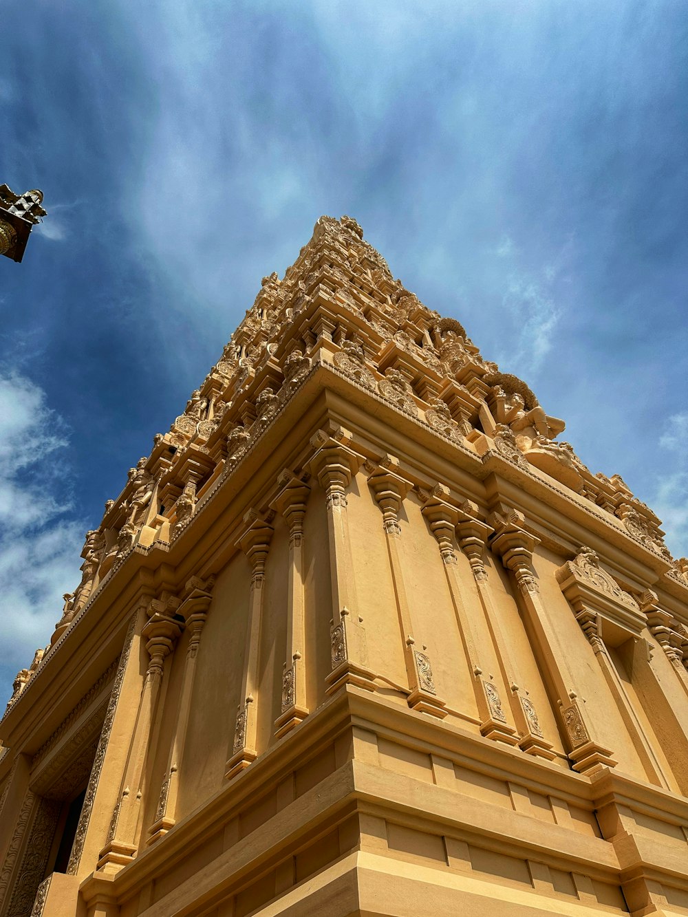 a tall tower with a clock on the top of it