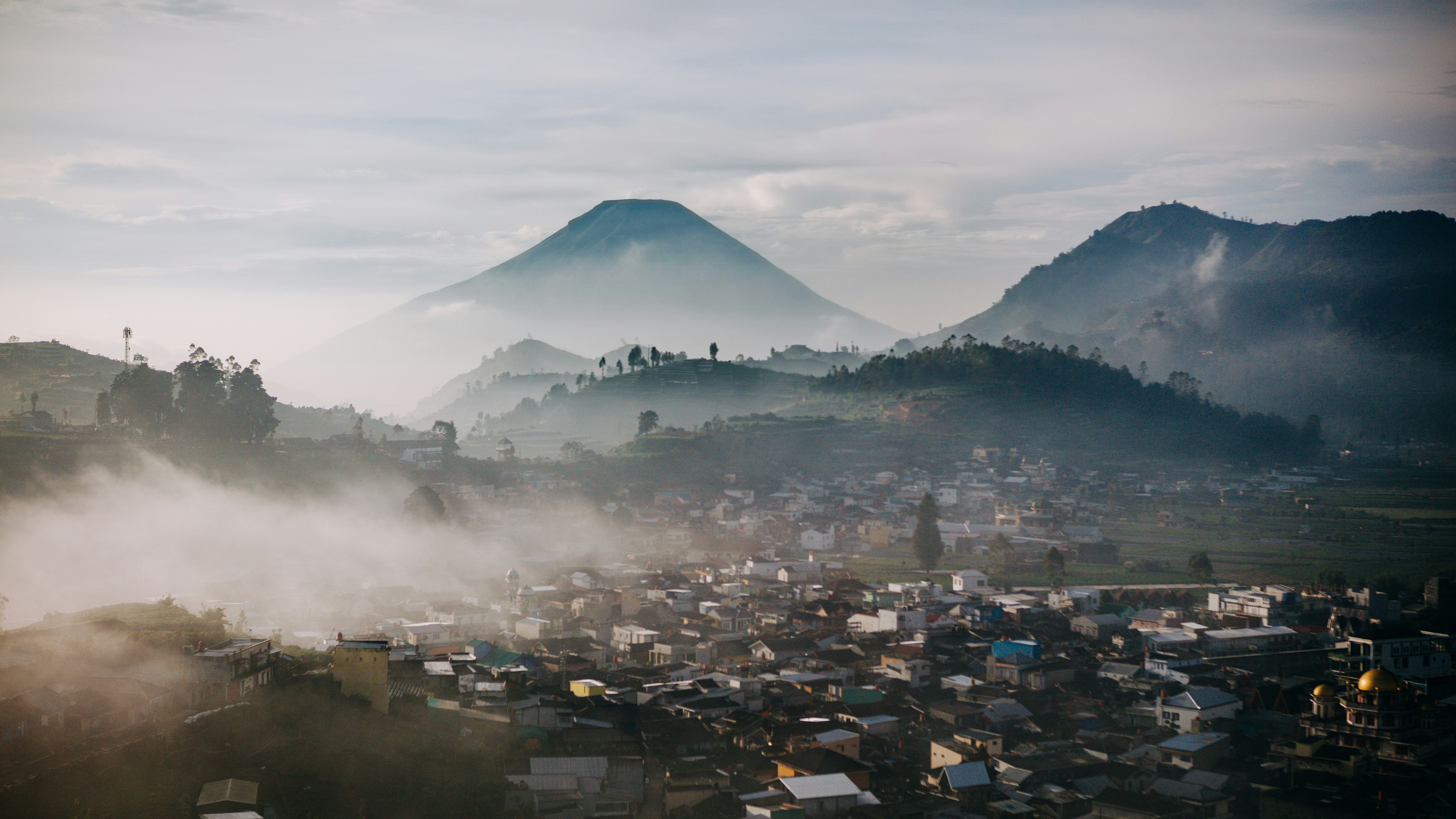 a city with a mountain in the background