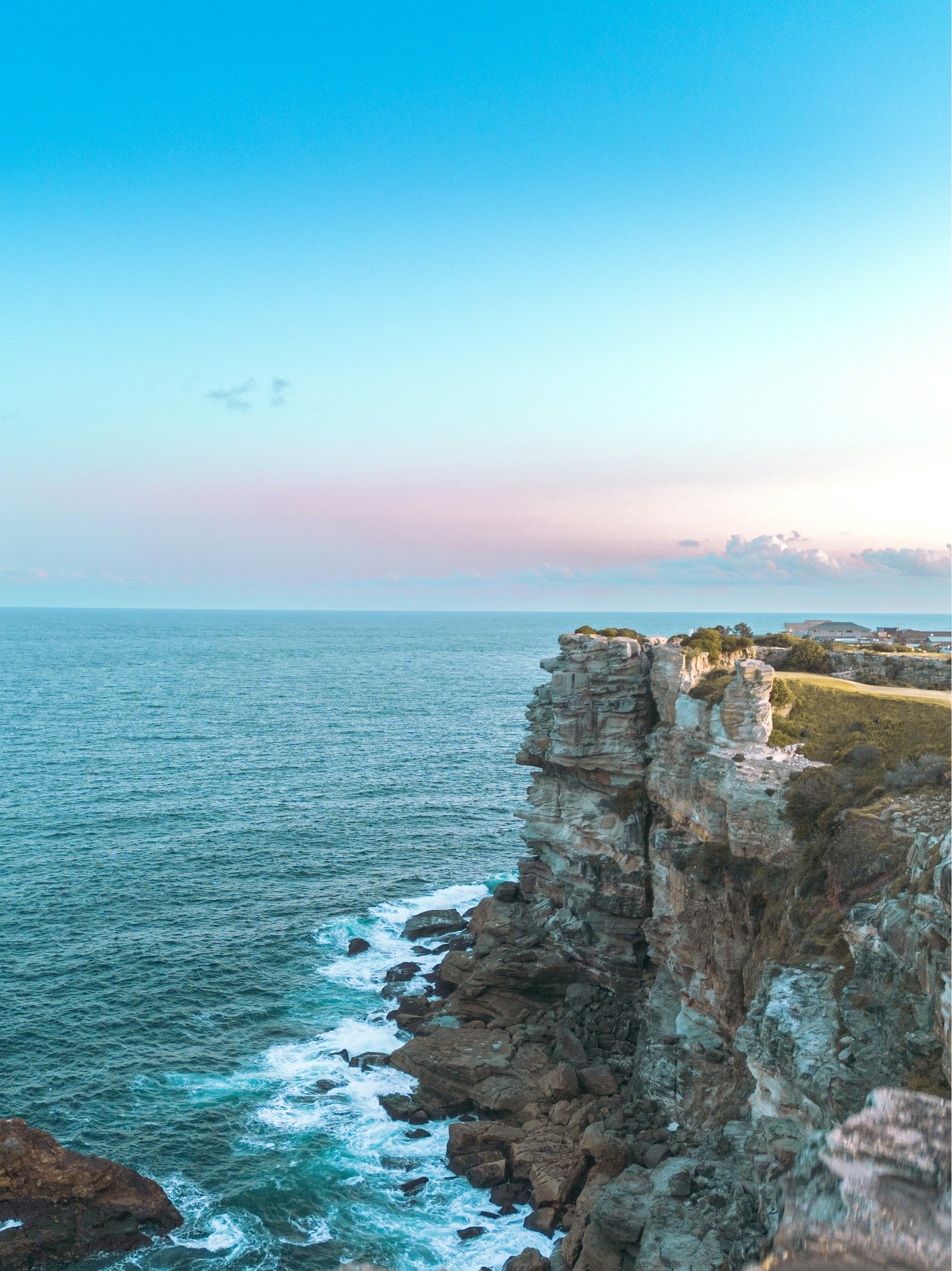 a view of the ocean from a cliff
