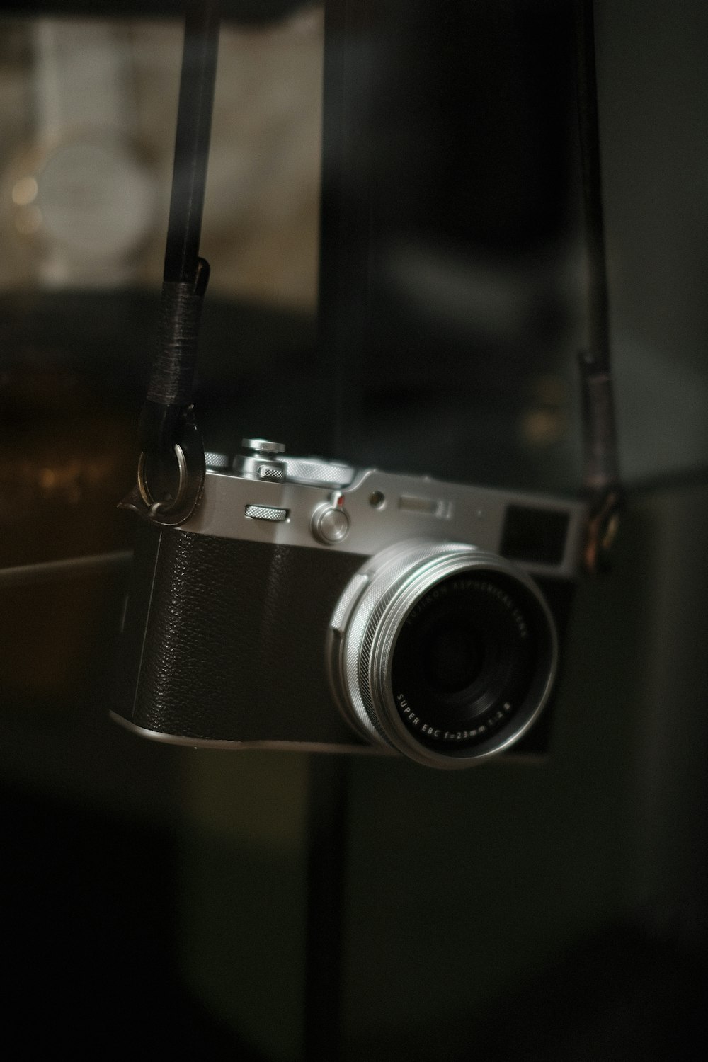 a camera hanging from the side of a window