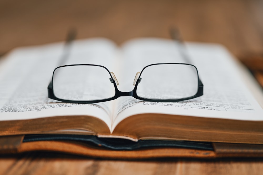 a book with a pair of glasses on top of it