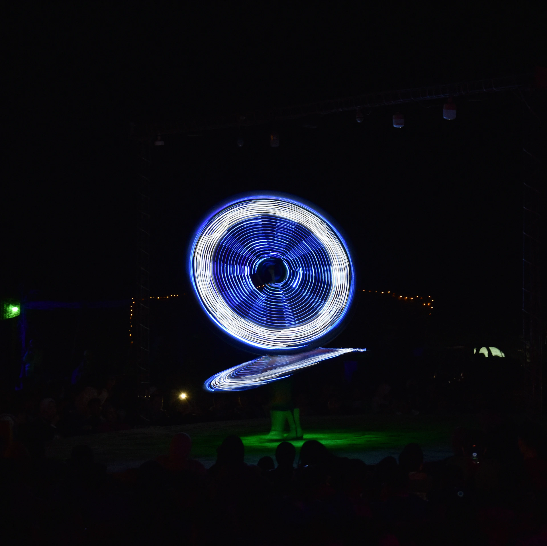 A captivating led dance performance glowing with vibrant colors and flowing movements at a stylish corporate gala.