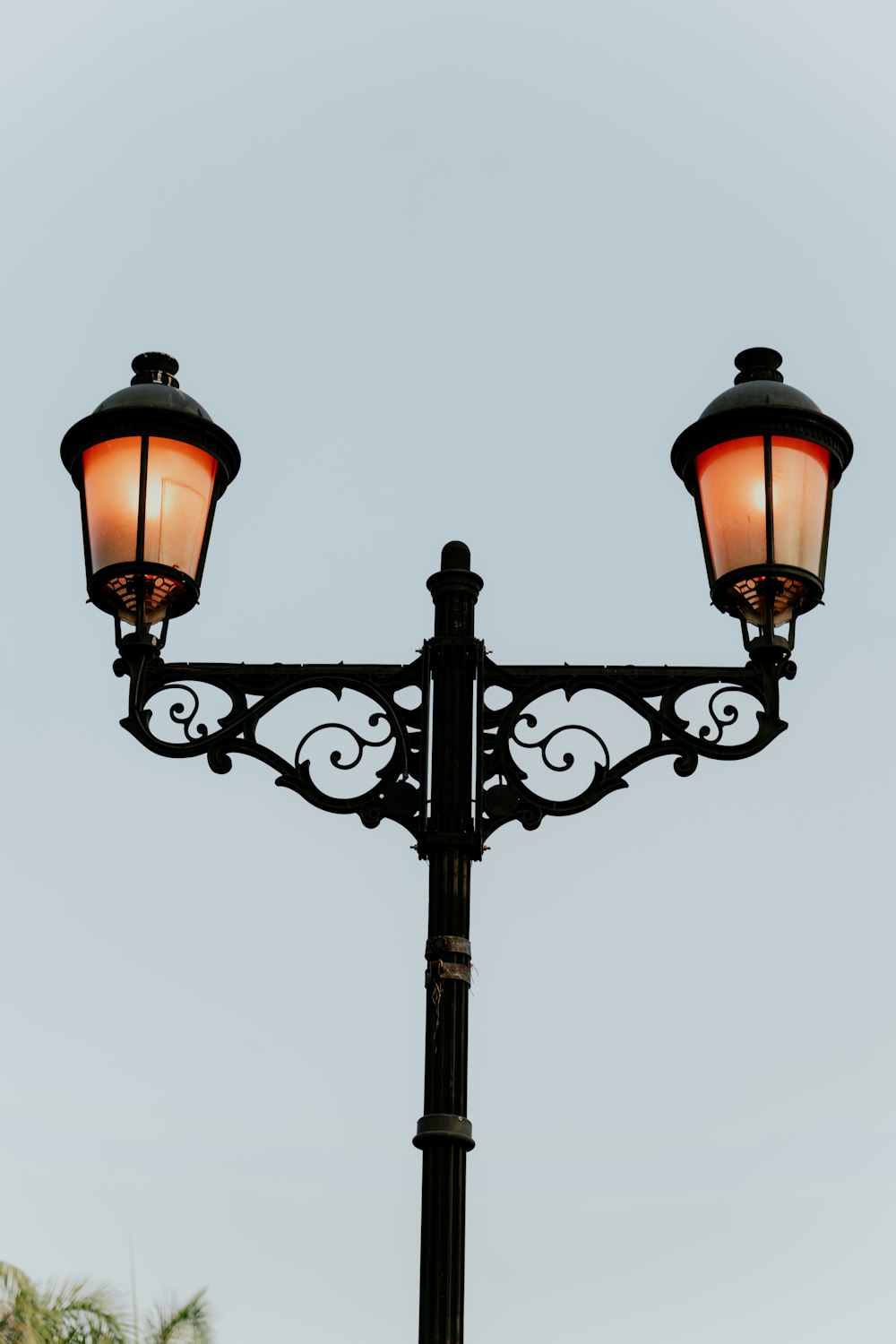 a lamp post with two lights on top of it