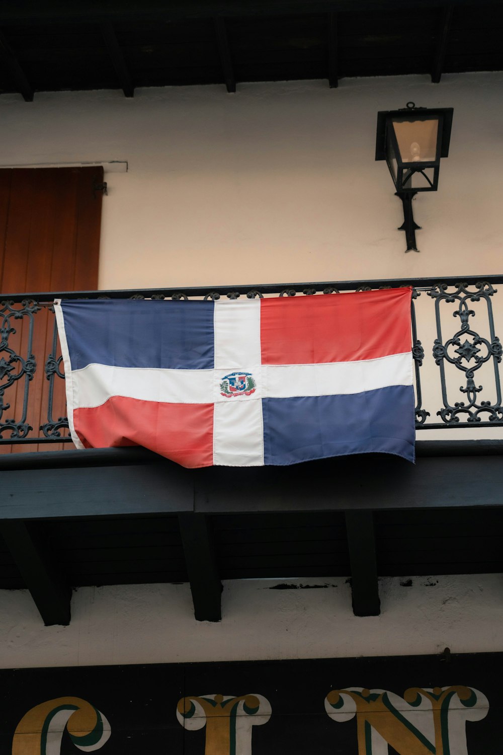 a flag hanging from the side of a building