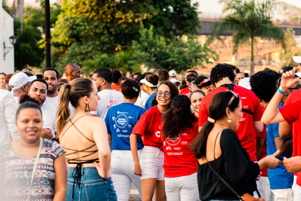 a group of people standing around each other