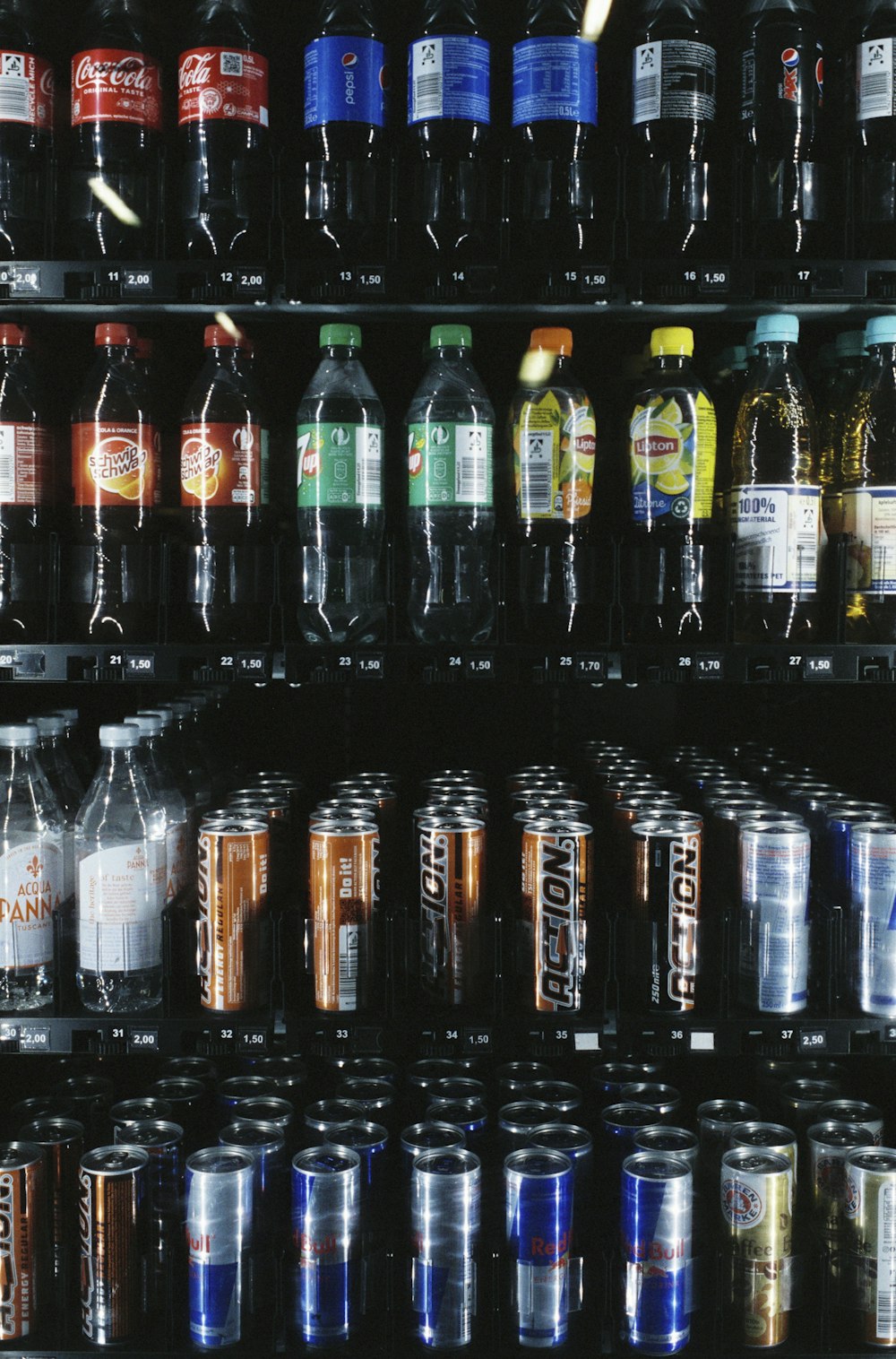 a refrigerator filled with lots of different types of drinks