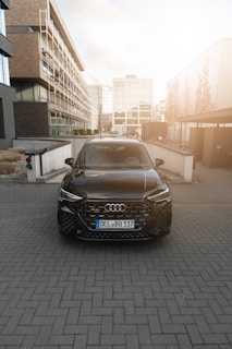A sleek Audi car parked in an urban setting.