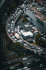 Aerial view of a busy highway with multiple lanes of traffic.