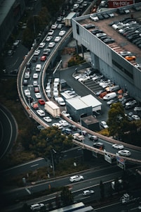 Aerial view of a busy transportation hub with trucks on the road.