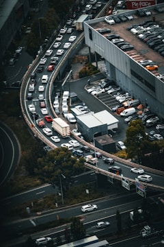 Aerial view of a busy highway with multiple lanes of traffic.