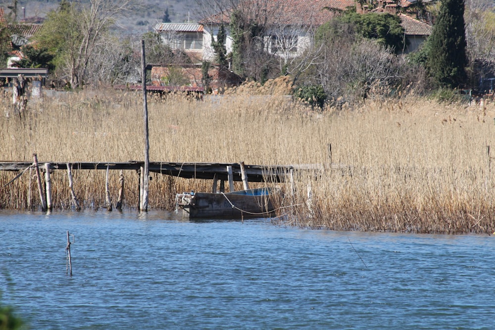 a boat sitting on top of a body of water