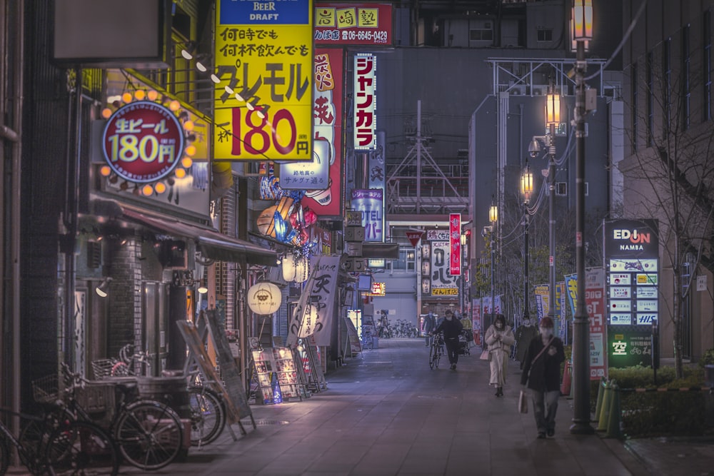 a city street filled with lots of neon signs