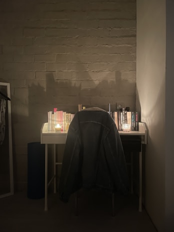 A cozy corner of Emma's workspace with a French flag and language books stacked neatly.