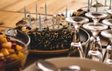 a table topped with a cake covered in chocolate frosting