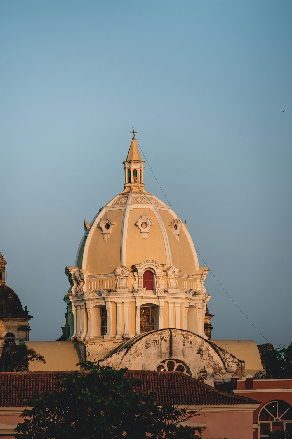 a building with a dome and a clock on top of it