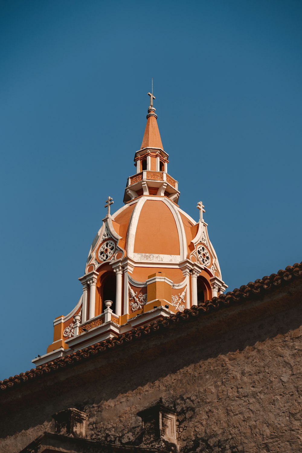 a tall building with a clock on the top of it