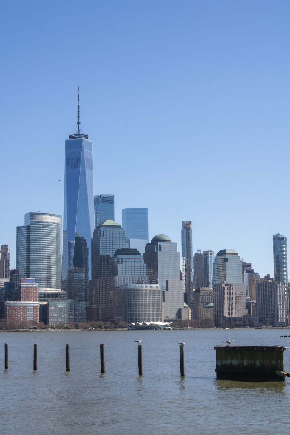 a large body of water with a city in the background