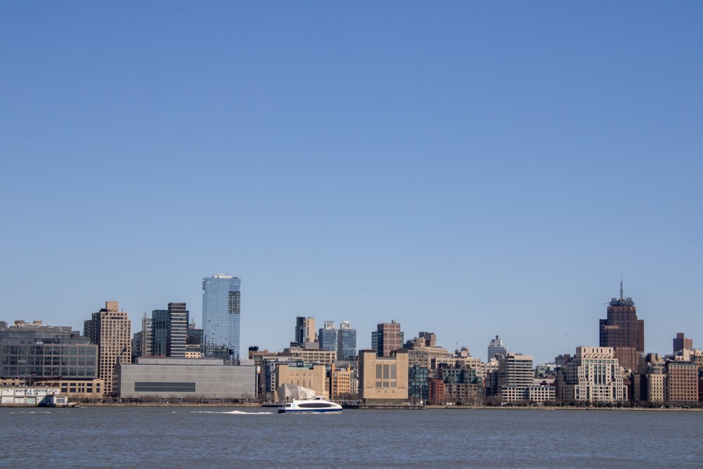 a large body of water with a city in the background