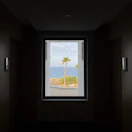 View from the Deluxe Room window showing swaying palm trees and ocean breeze.