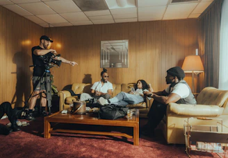 A diverse group of influencers filming content together in a cozy studio.