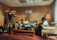Cozy Scandinavian-style photo shoot with a team planning social media content in a bright office.