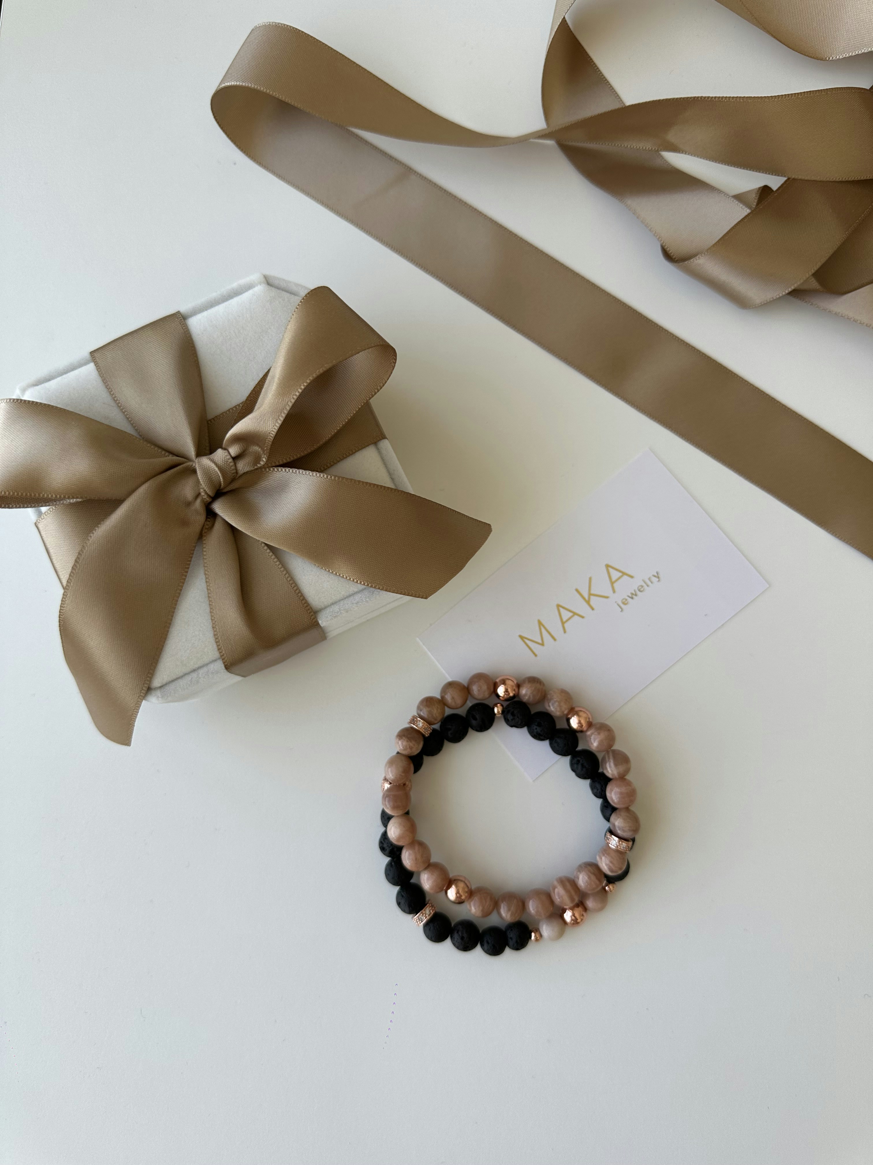 Elegant branded gift box with magnetic closure on white surface