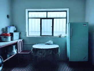 Student kitchen with shared appliances and dining table