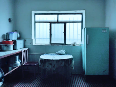 Student kitchen with shared appliances and dining table