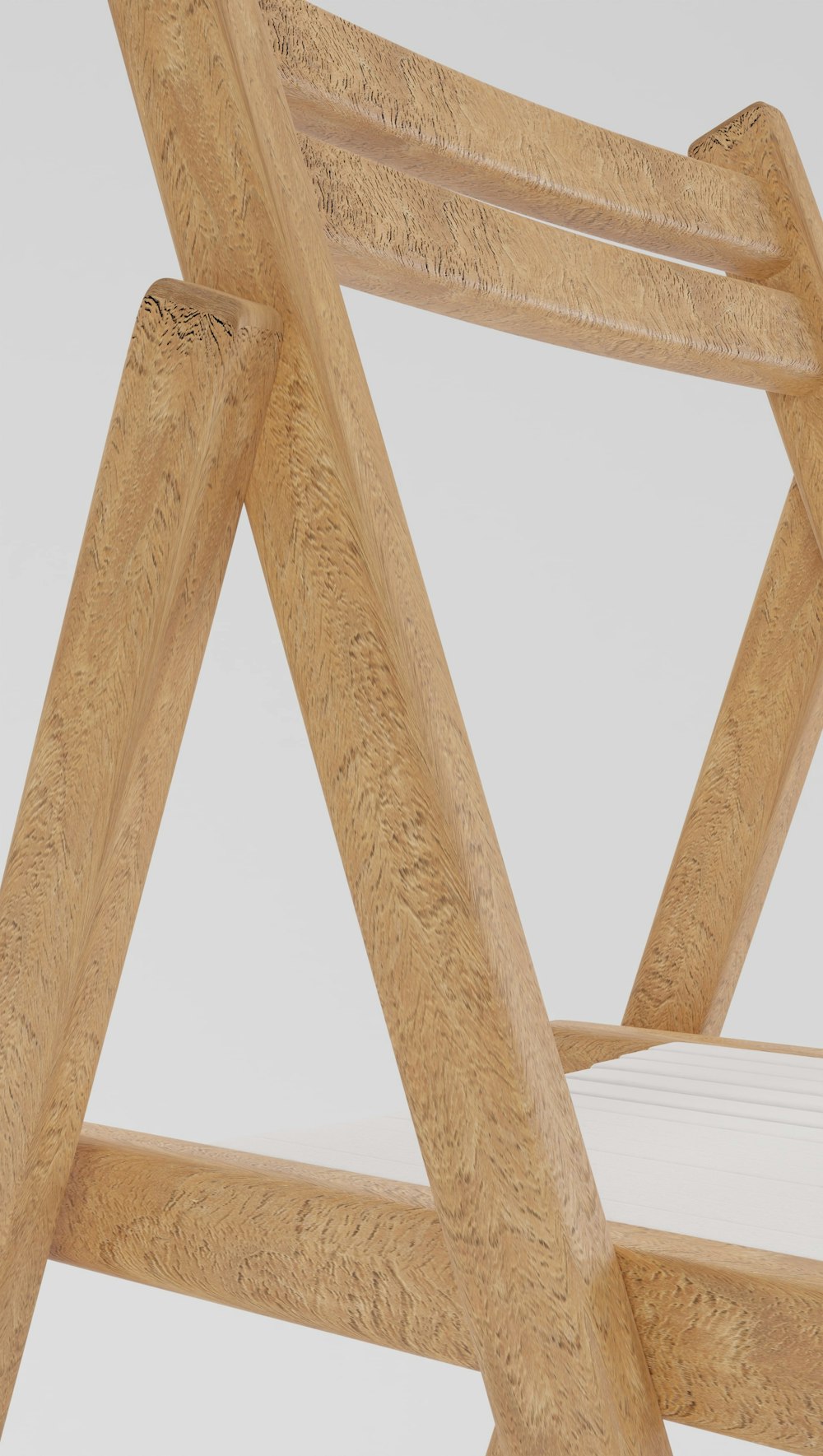 a close up of a wooden chair with a mattress